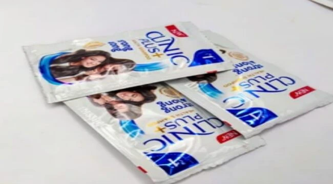 The image showing three pouch of clinic shampoo