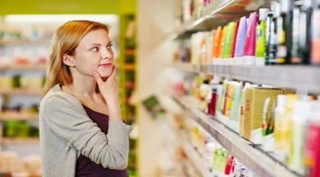 A beautiful girl choosing Personal care products for own self
