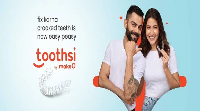 Virat Kohli and Anushka Sharma giving ad of toothsi