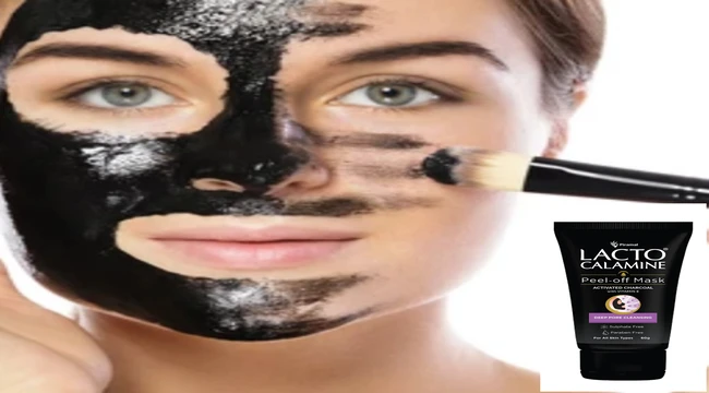 A beautiful woman applying Lacto calamine peel off mask on her face