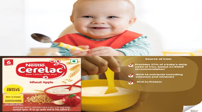 A baby hold a spoon on hands and smiling for eat nestle cerelac