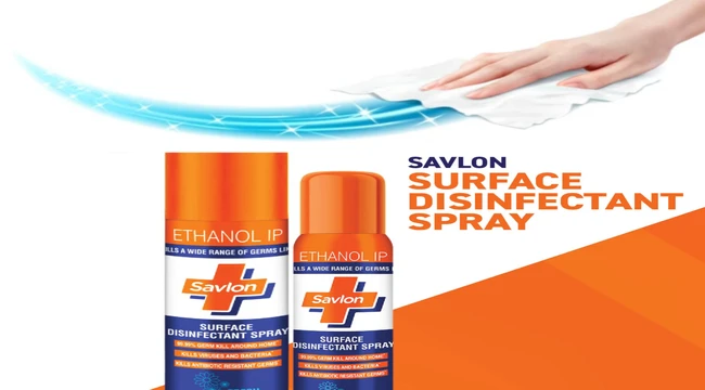 Beautiful hand makes cleaning the floor with savlon surface disinfectant spray