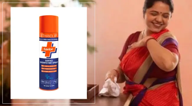 woman makes cleaning the house happily with savlon surface disinfectant spray