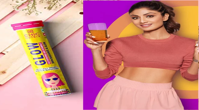 shilpa shetty holding a glass in hand for give advertisement