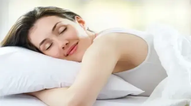 beautiful girl sleeps bedroom on doctor pillow